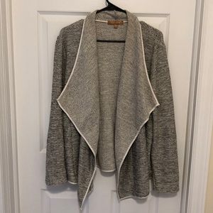 Gray sweater with white faux leather detail